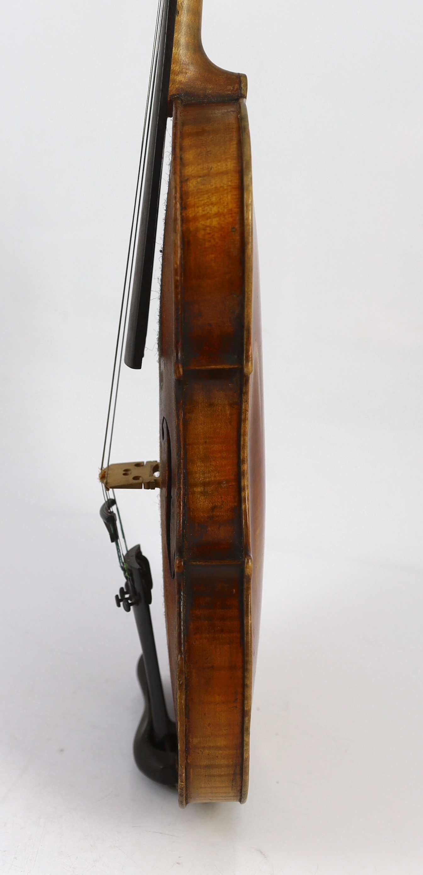 An 18th century violin, labelled ‘New Back by James Carroll, Maker, Manchester 1899’, length of back 36.5cm